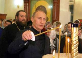 Путин поставил свечки за тех, кто пострадал, защищая людей в Новороссии