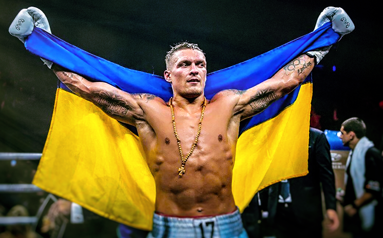 Чемпионская победа Усика "взорвала" соцсети: Сеть впечатлило знаковое фото боксера с флагом Украины над головой